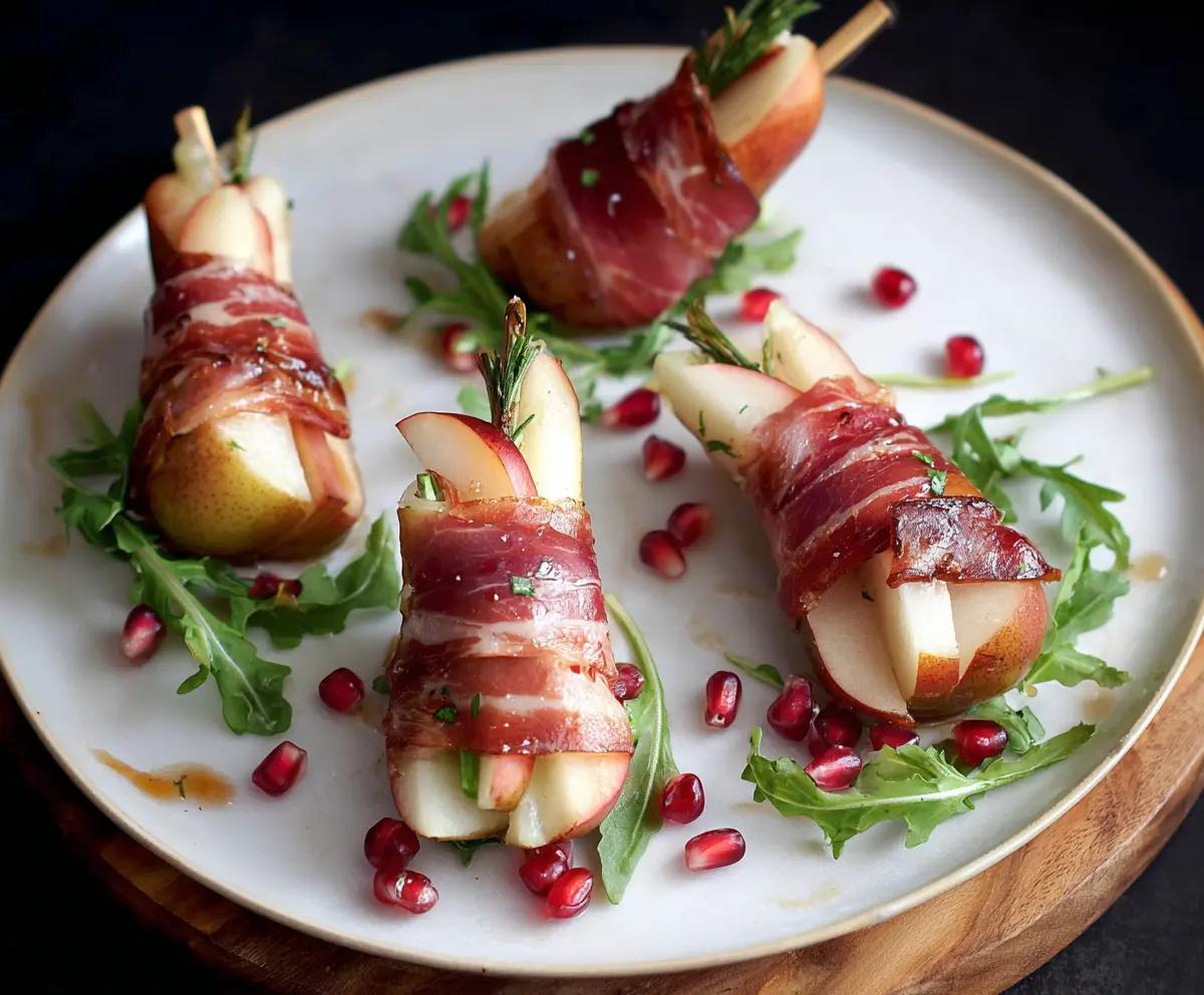 Prosciutto wrapped pears served as an elegant appetizer with a hint of sweetness and savory flavors.