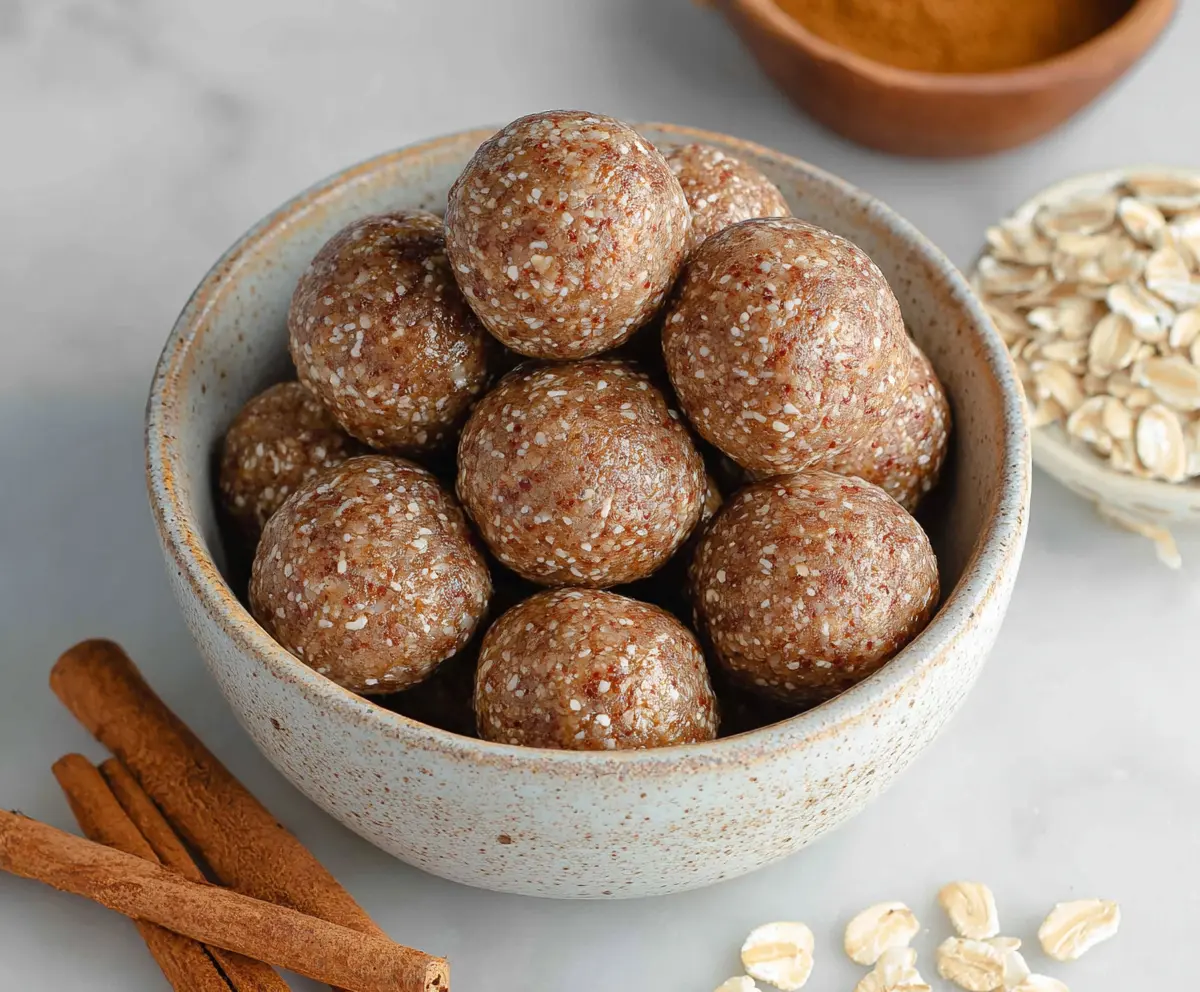 Delicious Cinnamon Roll Energy Bites with swirls of cinnamon and sugar in a bitesized treat.