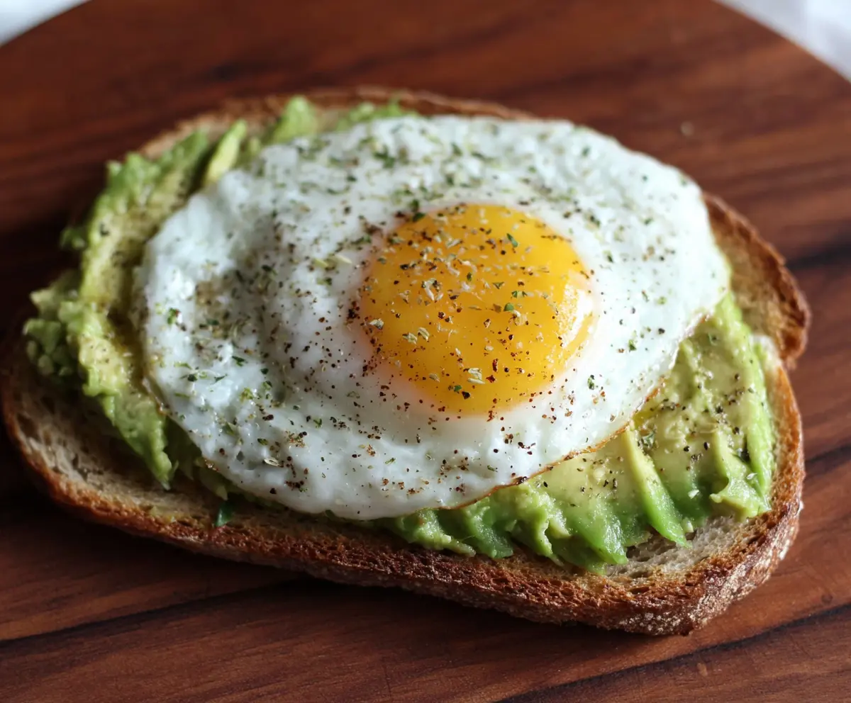 Delicious egg and avocado toast with crispy bread and fresh toppings