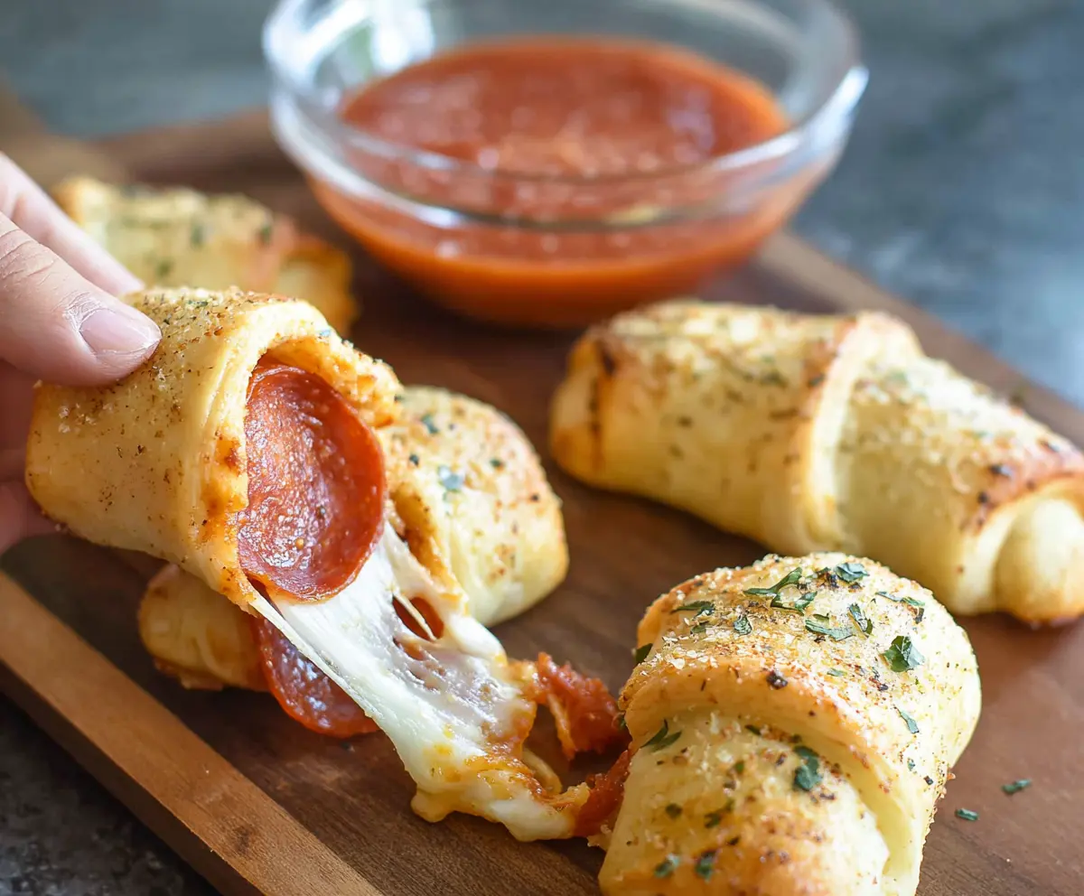 Delicious Pepperoni Cheese Roll Ups with melted cheese and crispy edges ready to serve.