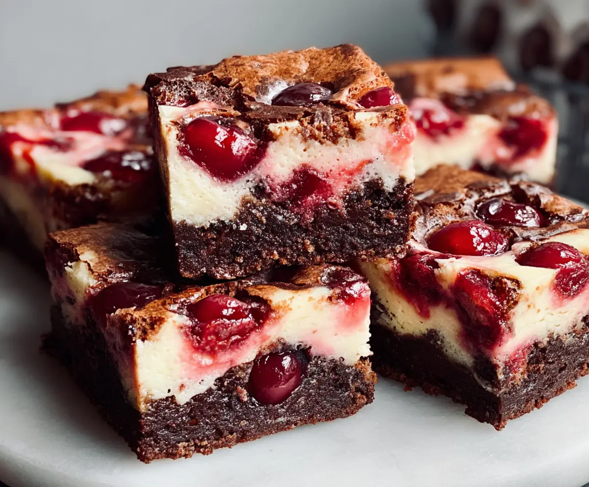 Delicious cherry cheesecake brownies with a rich chocolate base and cherry topping