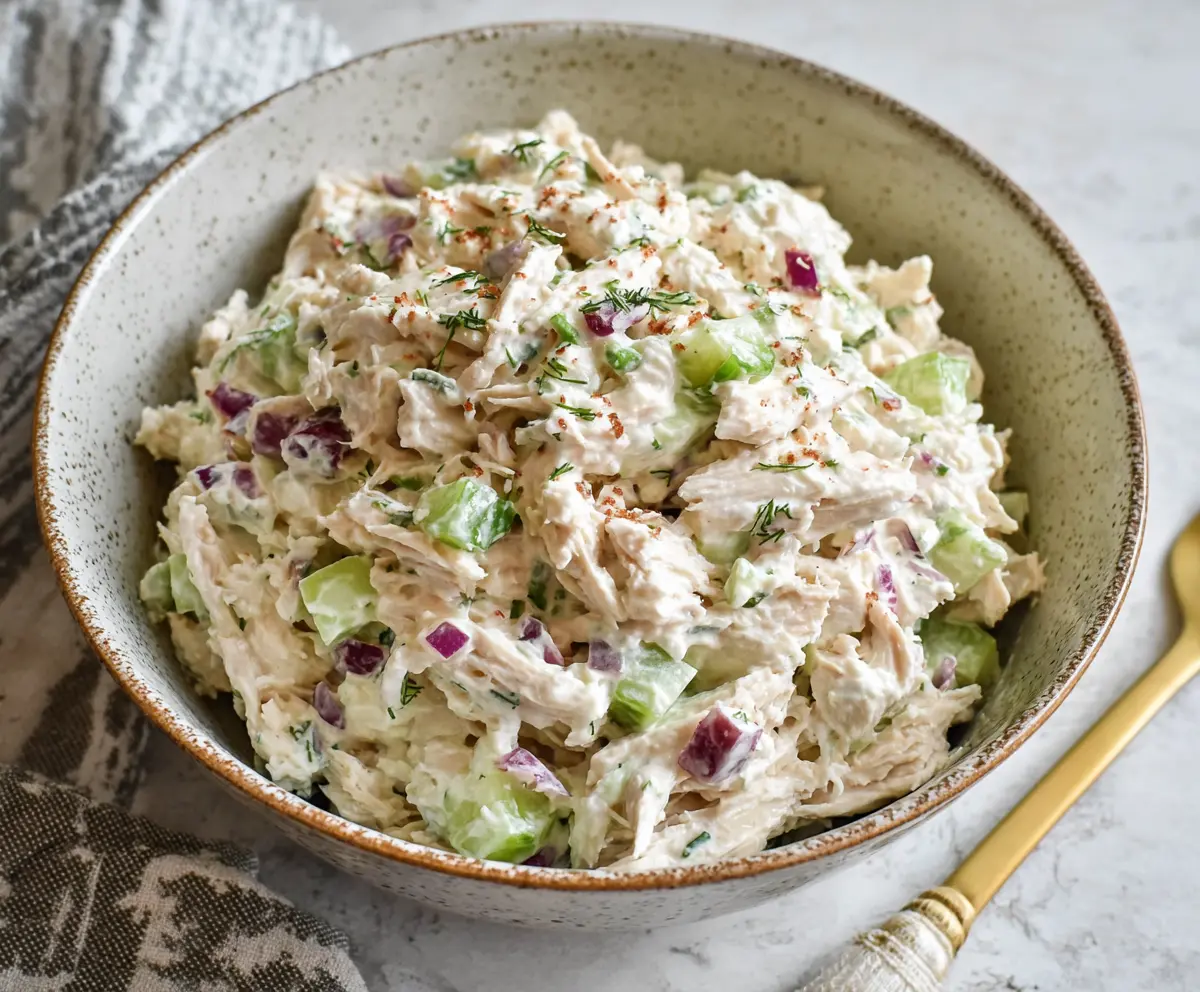 Delicious cottage cheese chicken salad with fresh vegetables and herbs.
